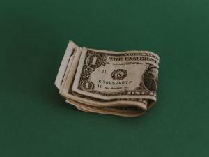Dollar bills folded in half part of property divided in divorce