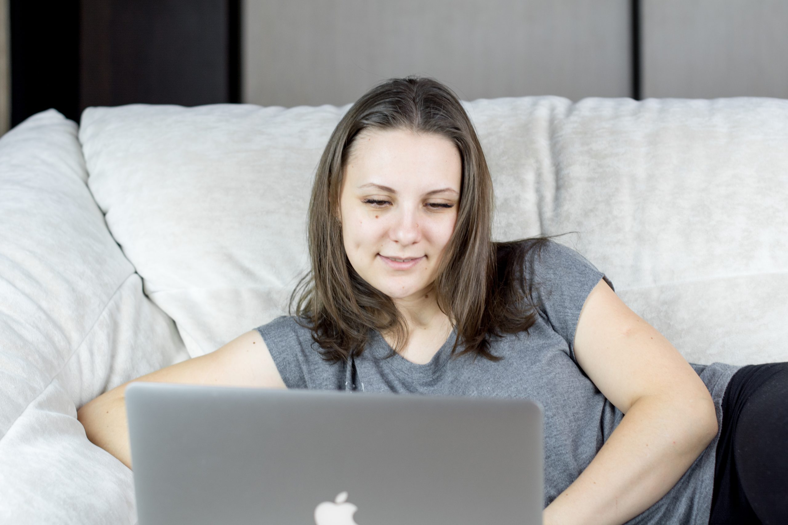Woman sitting at home researching Wisconsin divorce residency requirements