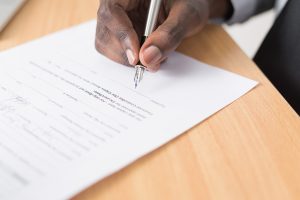 Prenups in Divorce in Wisconsin with spouse Signing of a document f