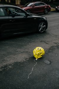 Emotional Trauma Compensation in Wisconsin with balloon outside car on street